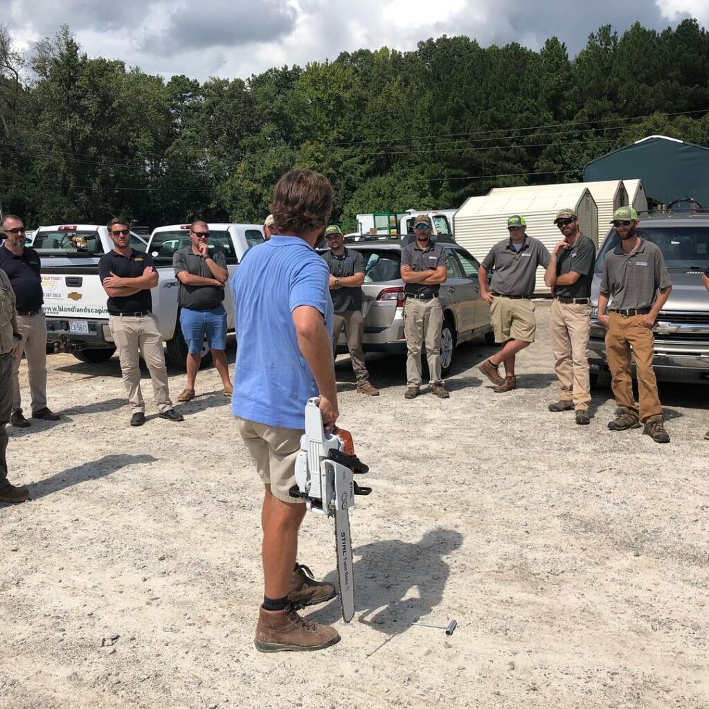 Bland team member chainsaw training